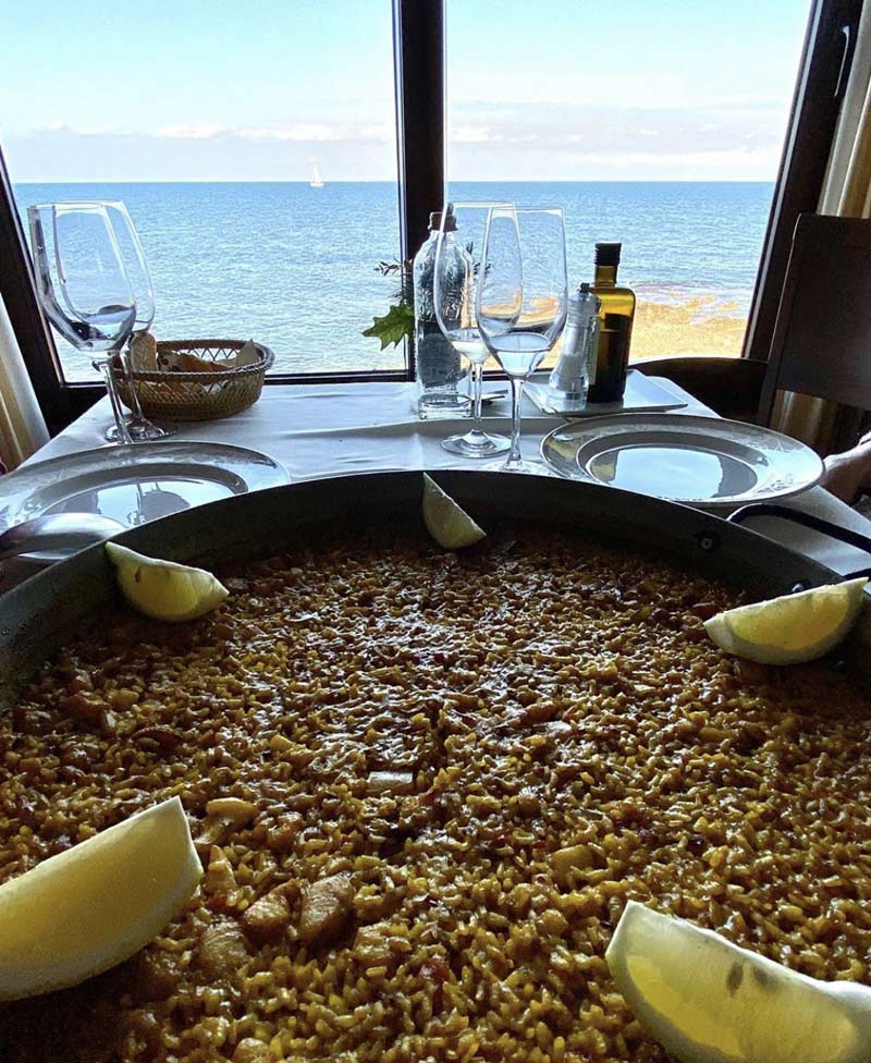 Paella in front of the sea