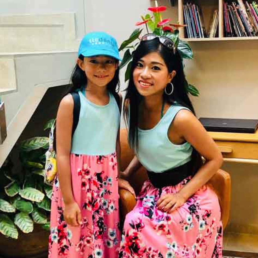 Mother and daughter at school learning Spanish