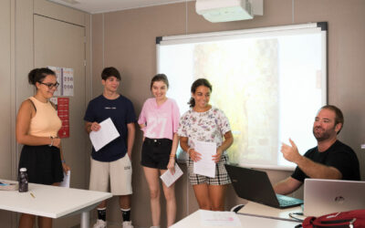 Students doing an exposition in Spanish class for teens in Spain